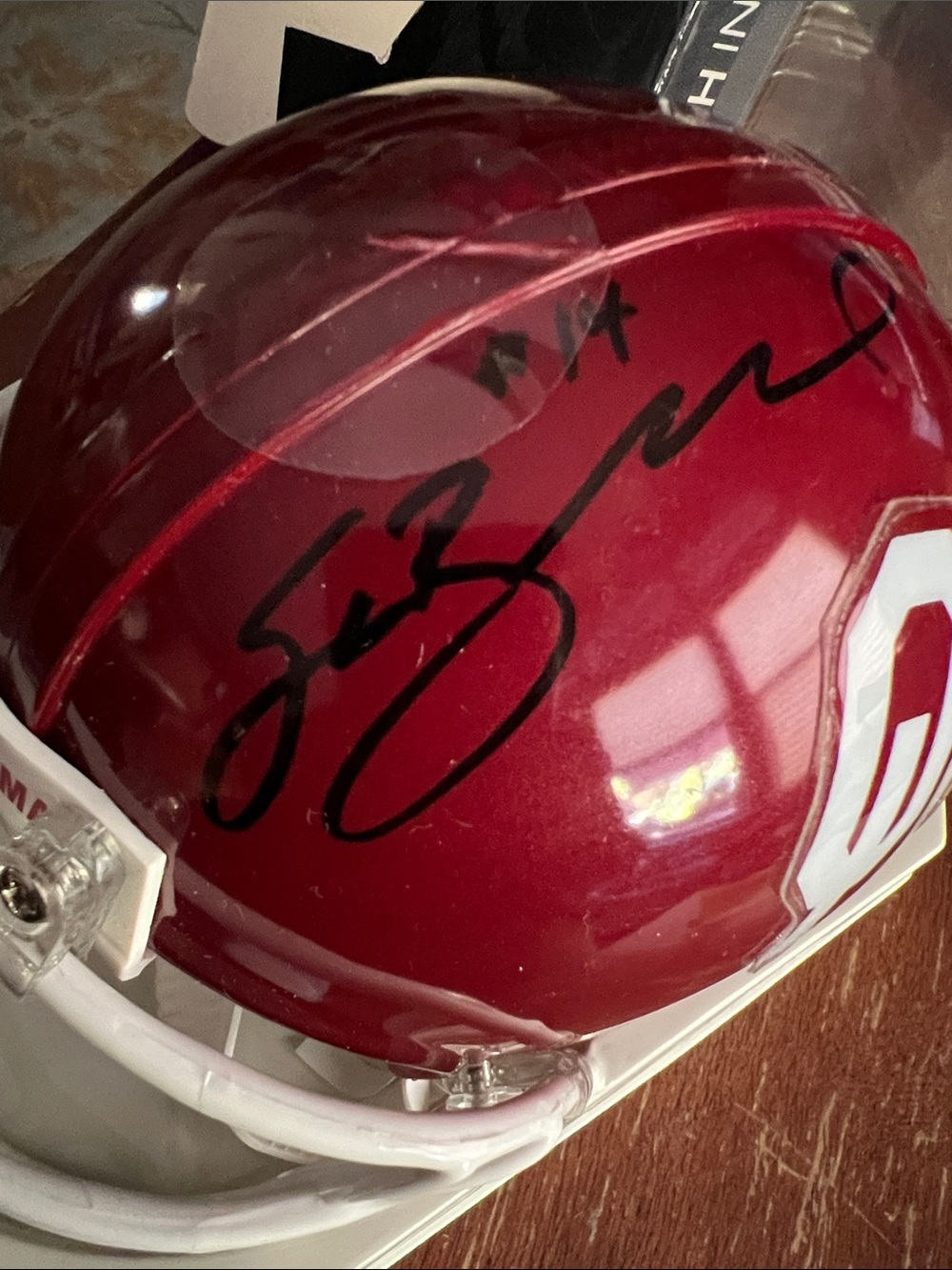 Signed Crimson Mini Helmet by Sam Bradford. JSA Certified.